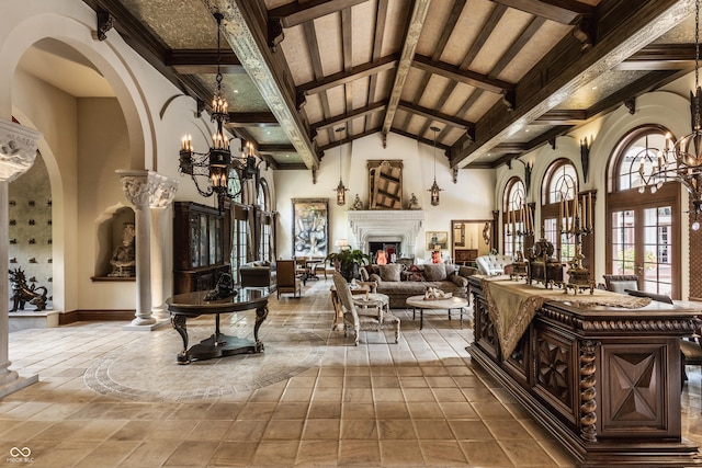 841 Alverna Dr, Indianapolis, IN 46260 - living room with a chandelier, decorative columns, beamed ceiling, high vaulted ceiling, and arched walkways