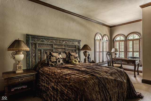 bedroom with a textured ceiling, carpet flooring, and crown molding