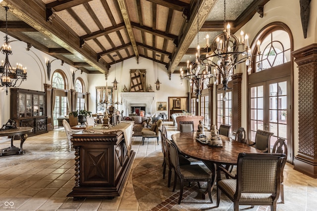 dining room with high vaulted ceiling, a chandelier, beamed ceiling, and french doors