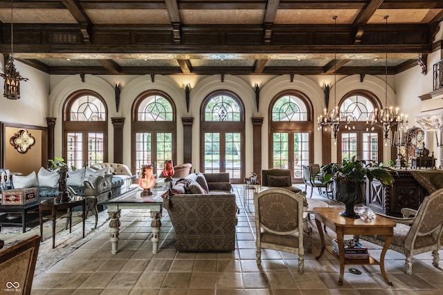 interior space featuring beam ceiling, coffered ceiling, an inviting chandelier, and french doors