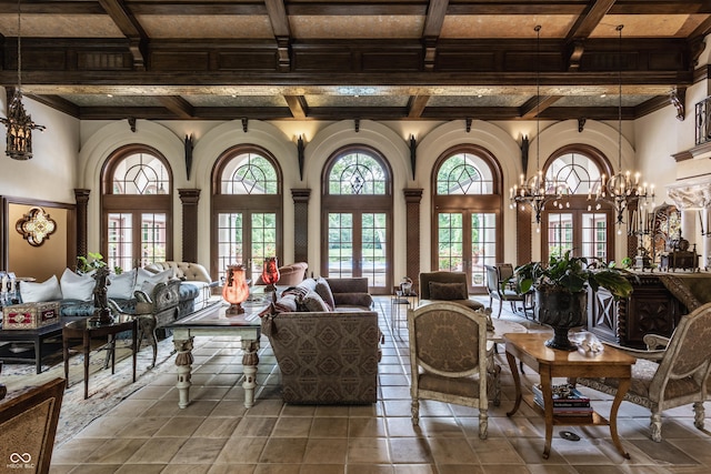 841 Alverna Dr, Indianapolis, IN 46260 - living room featuring coffered ceiling, beamed ceiling, ornamental molding, a chandelier, and tile patterned floors