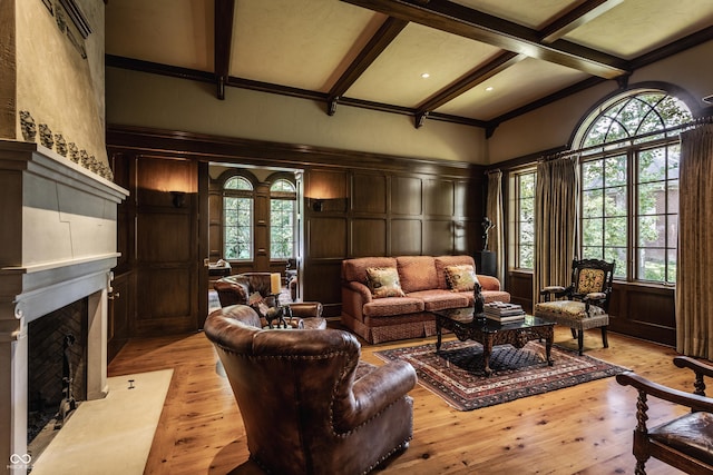 841 Alverna Dr, Indianapolis, IN 46260 - living area with a decorative wall, healthy amount of natural light, beam ceiling, a high end fireplace, and light wood finished floors