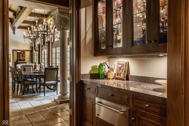 bar featuring dark stone counters, dark brown cabinets, beam ceiling, and tile patterned floors