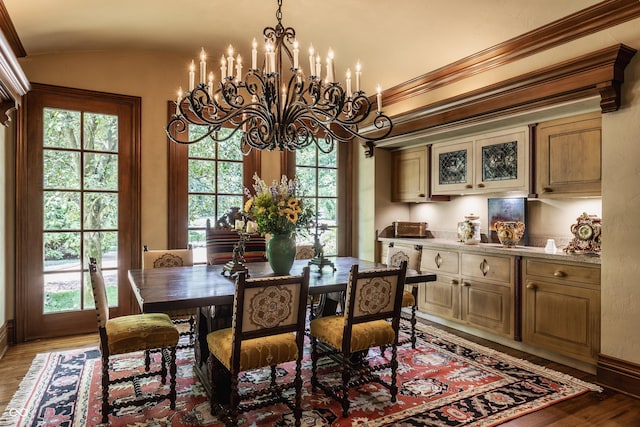 841 Alverna Dr, Indianapolis, IN 46260 - dining space featuring vaulted ceiling, light wood-style floors, a chandelier, and plenty of natural light