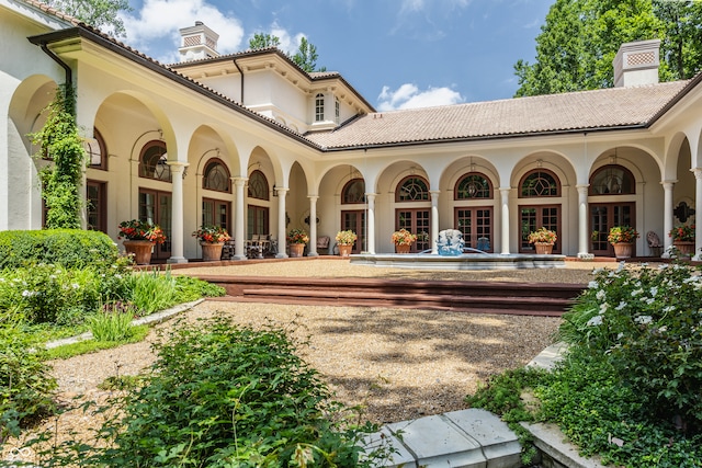 back of house featuring french doors