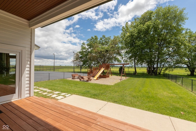 view of yard featuring a playground and a patio