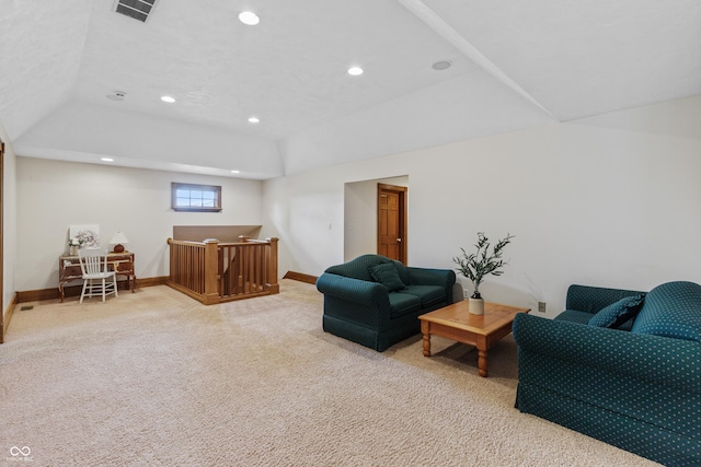 carpeted living room with a raised ceiling