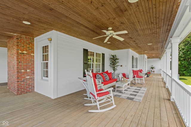 wooden deck featuring ceiling fan and a porch