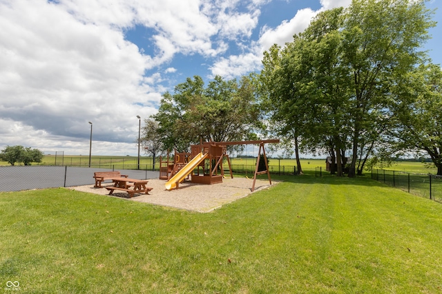 view of playground with a lawn