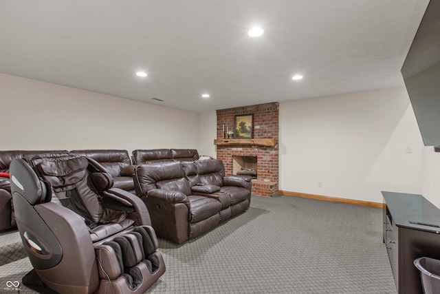 carpeted home theater room featuring a fireplace