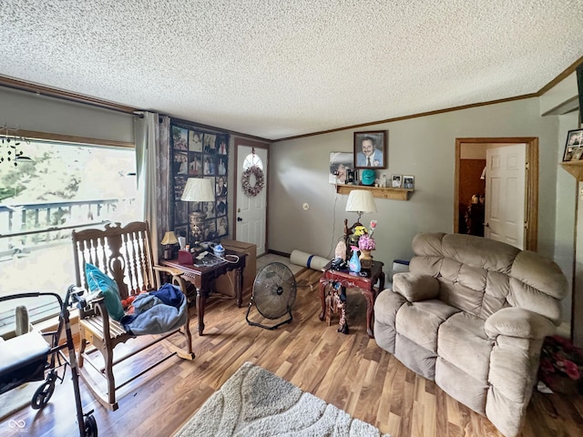 living room featuring crown molding, vaulted ceiling, a textured ceiling, and hardwood / wood-style flooring