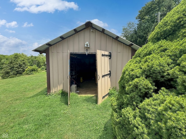 view of outbuilding with a lawn