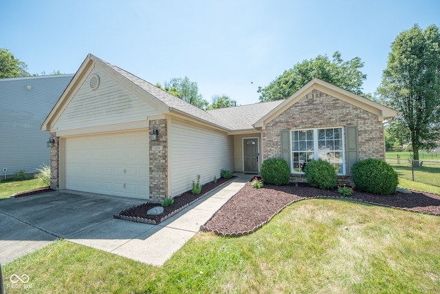 single story home featuring a garage and a front lawn