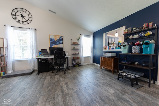 office area with hardwood / wood-style flooring and vaulted ceiling