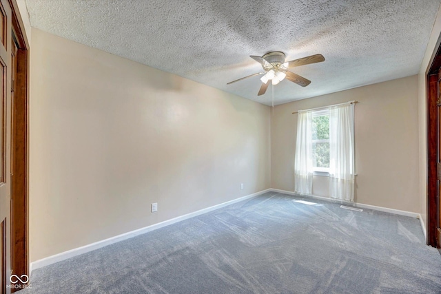 empty room featuring carpet, ceiling fan, and a textured ceiling