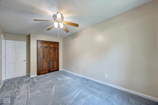 unfurnished bedroom with carpet flooring, ceiling fan, and a textured ceiling