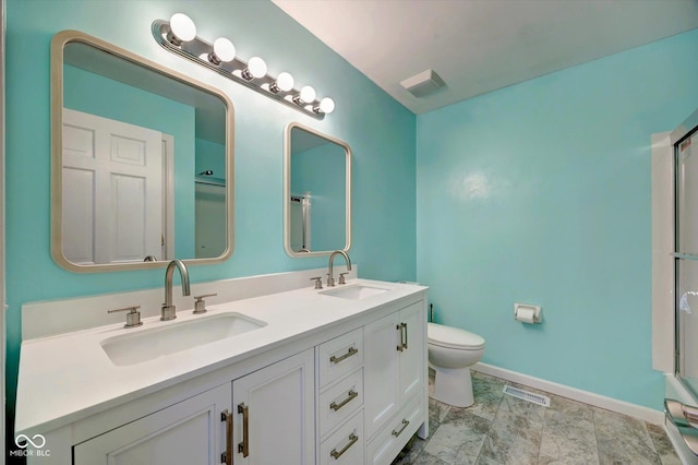 bathroom featuring vanity and toilet