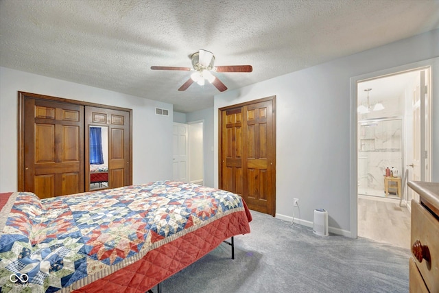 bedroom with connected bathroom, ceiling fan, carpet floors, and a textured ceiling