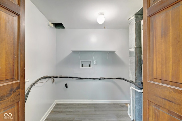 laundry area with hookup for a washing machine and hardwood / wood-style flooring