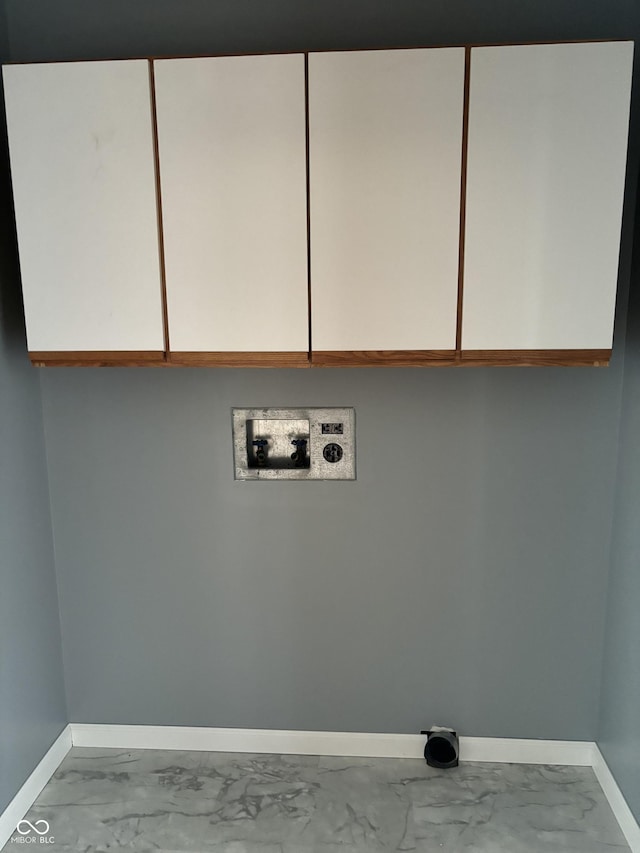 washroom featuring washer hookup and cabinets