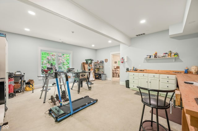 workout room with recessed lighting, baseboards, and light colored carpet