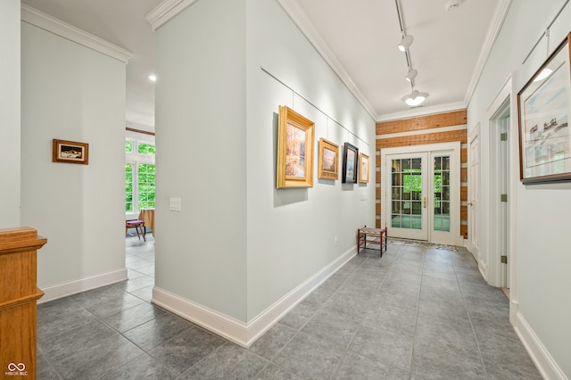 hall with tile patterned flooring, track lighting, and french doors