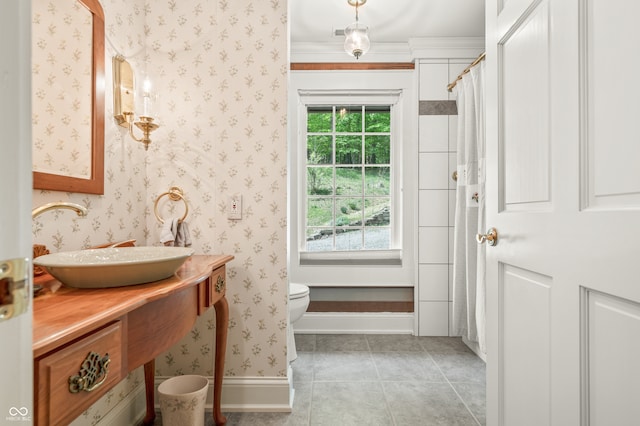 bathroom with vanity, tile patterned flooring, toilet, and crown molding