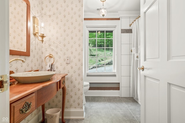 full bath with wallpapered walls, tile patterned floors, toilet, and a healthy amount of sunlight