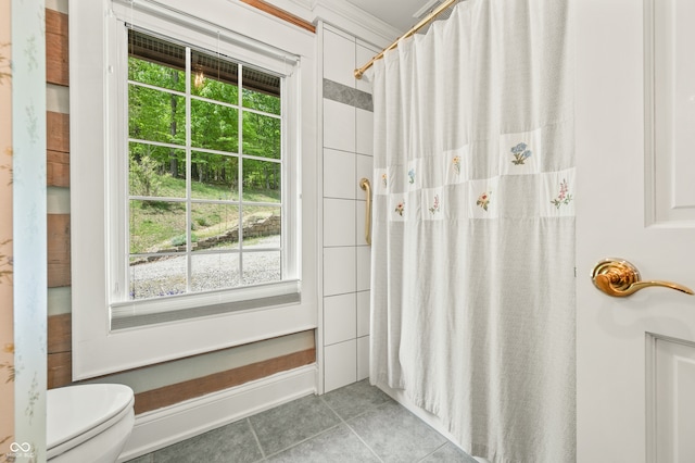 bathroom with tile patterned flooring and toilet