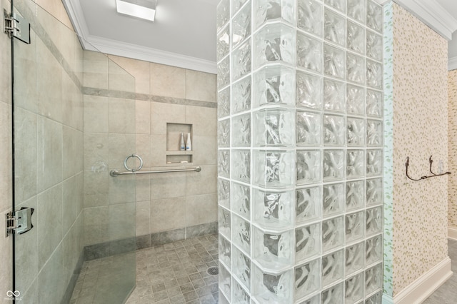 bathroom featuring crown molding and a tile shower