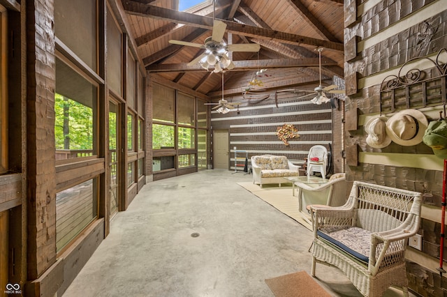 interior space featuring concrete flooring, wood ceiling, a wealth of natural light, and ceiling fan