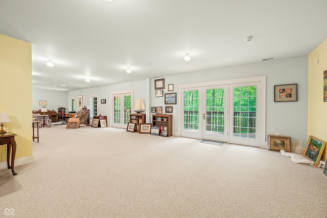 miscellaneous room featuring visible vents and carpet floors