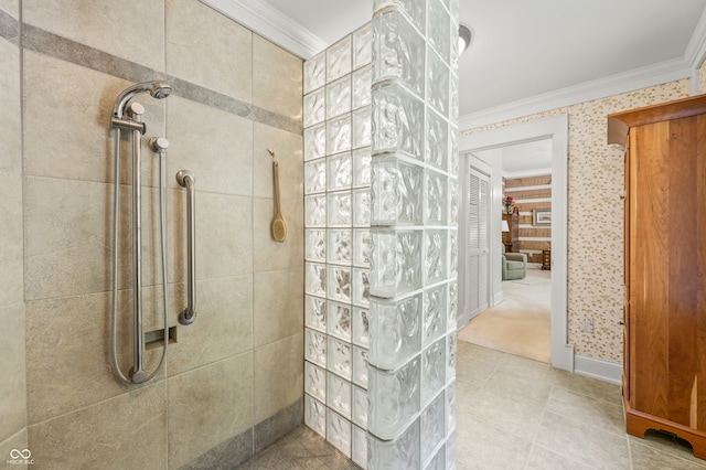 bathroom featuring tiled shower, tile patterned flooring, and ornamental molding