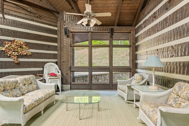 sunroom / solarium with a wealth of natural light, wooden ceiling, ceiling fan, and vaulted ceiling with beams