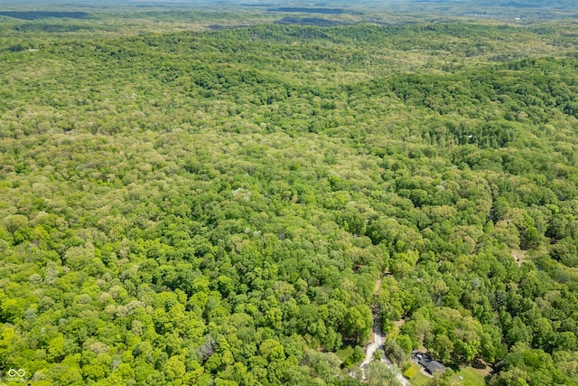 bird's eye view featuring a view of trees