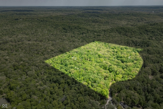 aerial view featuring a wooded view