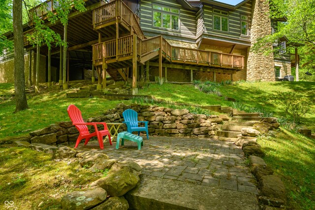 exterior space featuring a deck and a patio