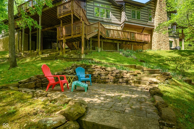 exterior space with stairway, a patio, and a deck