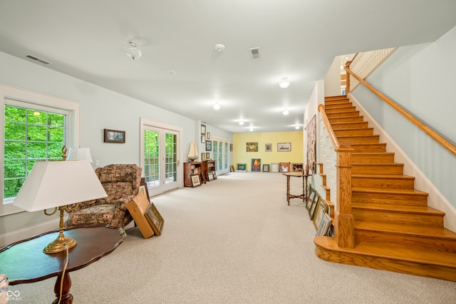 carpeted living room with french doors