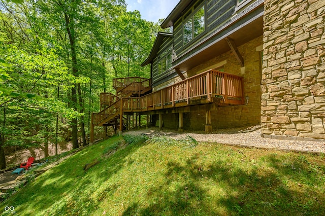 view of yard with stairway and a wooden deck