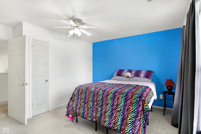 bedroom featuring light carpet and ceiling fan