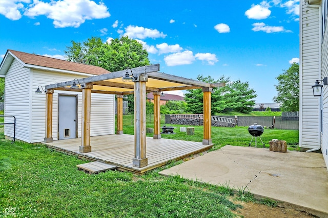 exterior space with a pergola, a patio area, a deck, and a yard