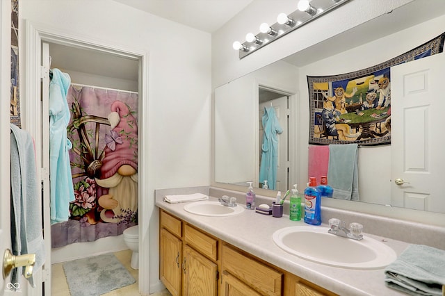 bathroom featuring toilet, a shower with shower curtain, tile patterned flooring, and vanity