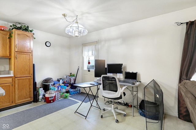 office space with an inviting chandelier