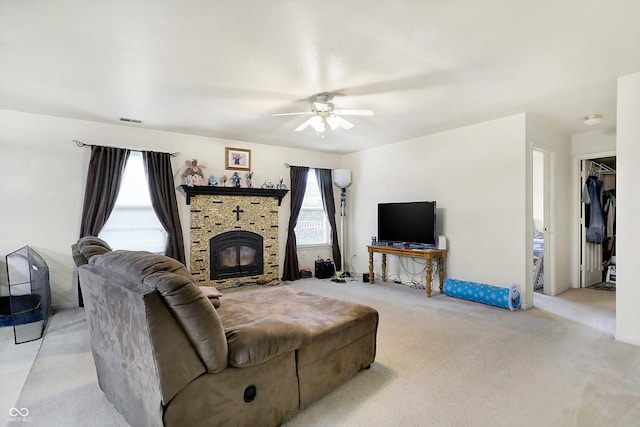 living room featuring ceiling fan and light carpet