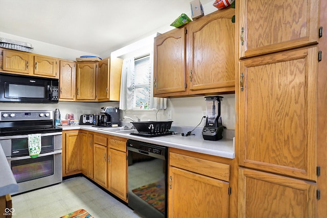 kitchen featuring sink and black appliances