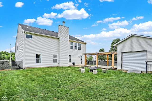 back of property featuring a lawn and a pergola