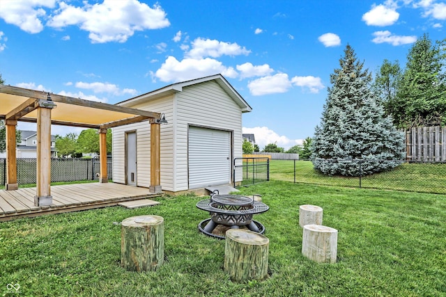 view of yard featuring a wooden deck and an outdoor structure