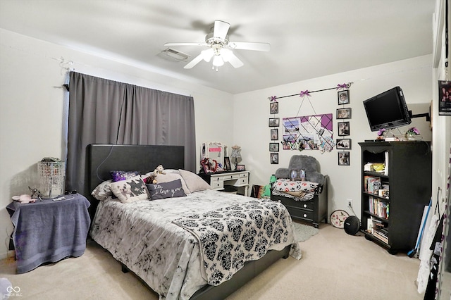 bedroom featuring ceiling fan and light carpet