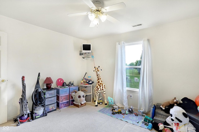 playroom with carpet floors and ceiling fan